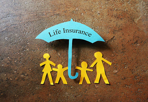 A paper family sheltered under an umbrella, representing lifelong protection